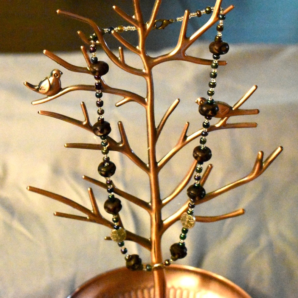 Handmade necklace with metal and wood beads.